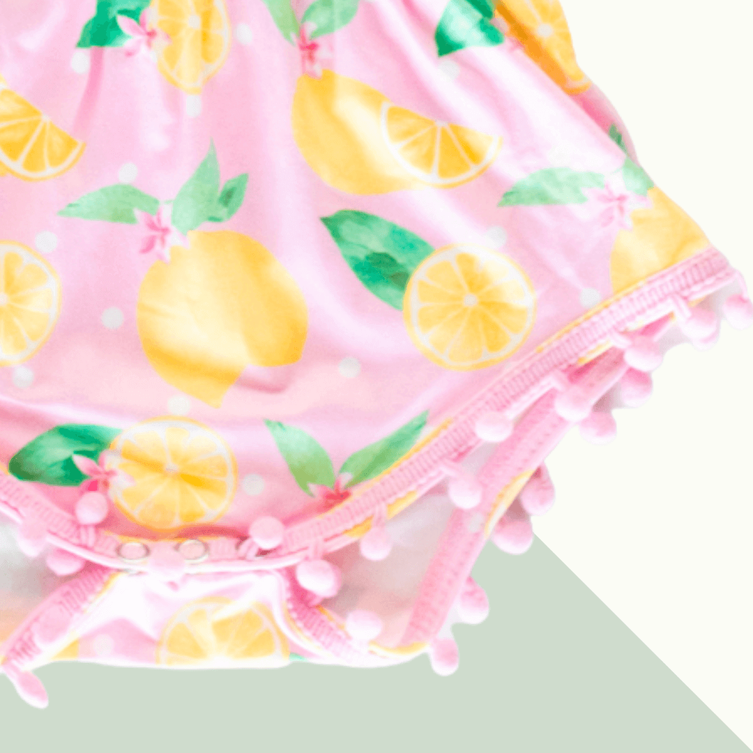 Pink Lemonade Pom Pom Romper - Evvie Bean's Baby Boutique