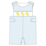 Children's overalls with duck design on a white background
