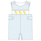 Children's overalls with duck design on a white background