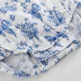 Blue Floral and Bow Print Apron Ruffle Romper