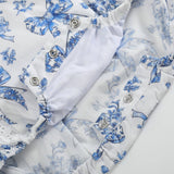 Blue Floral and Bow Print Apron Ruffle Romper