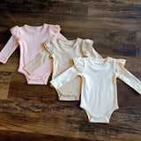 Evvie Bean's Basics Ruffle Onesie