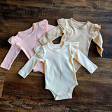Evvie Bean's Basics Ruffle Onesie